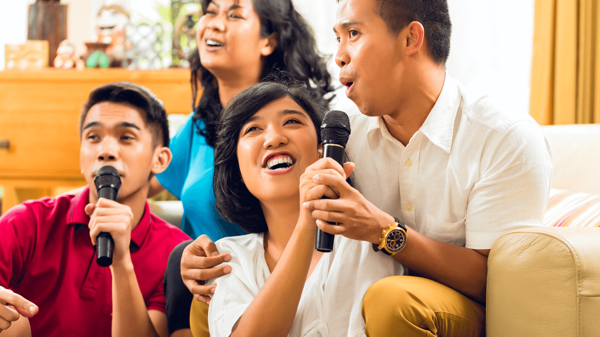 Filipino friends singing in a karaoke session