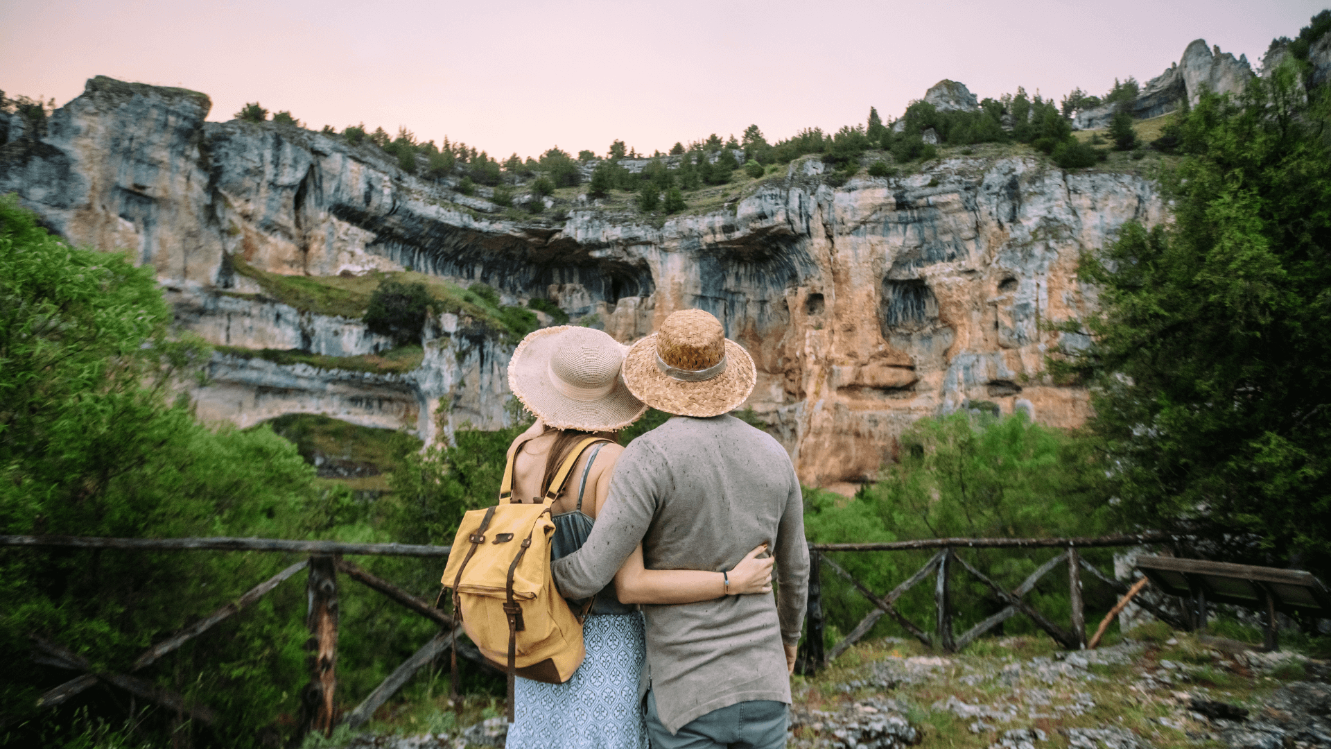 Traveling couple looking at a rock formation