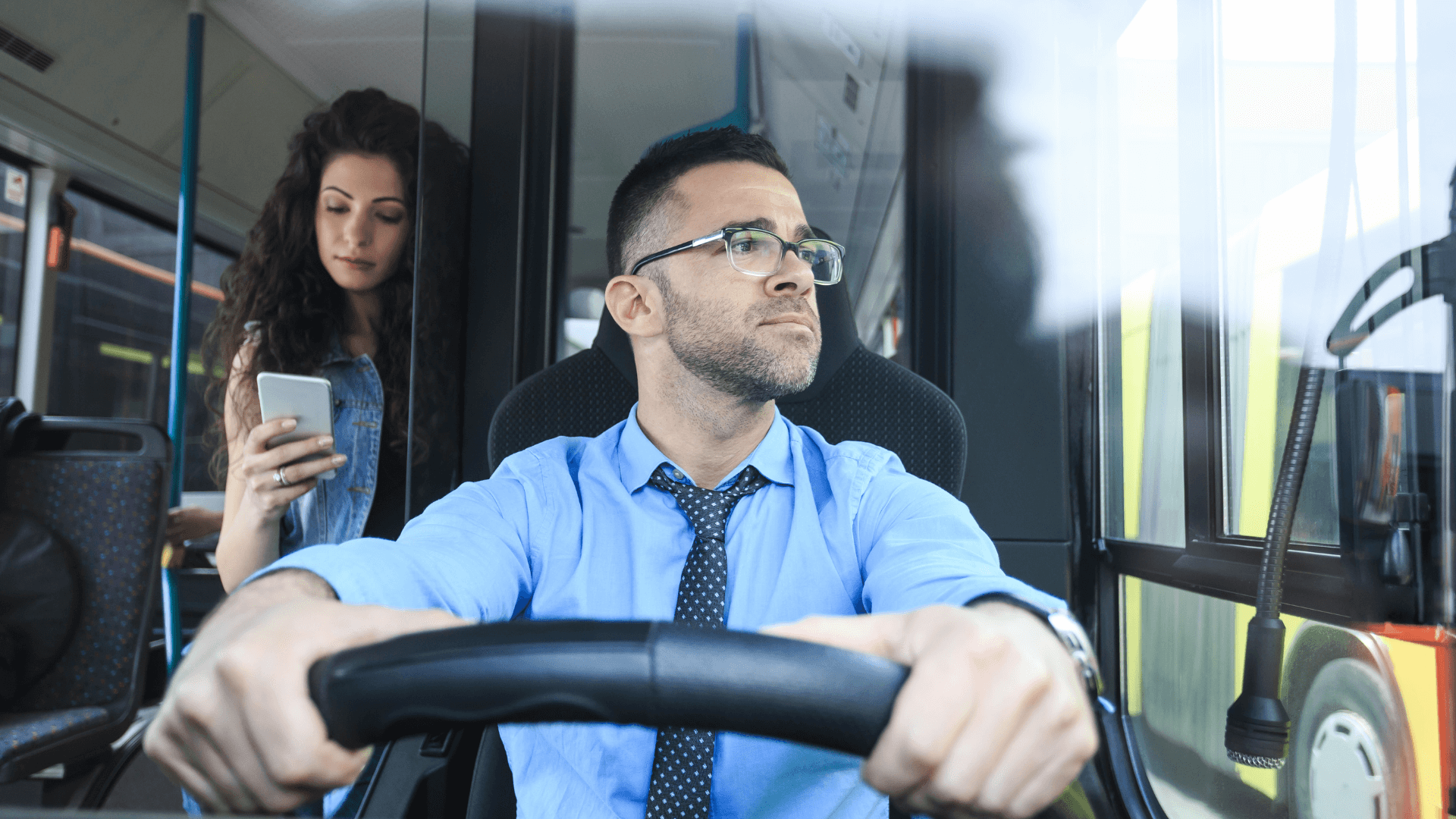 Bus driver with his passenger on a bus