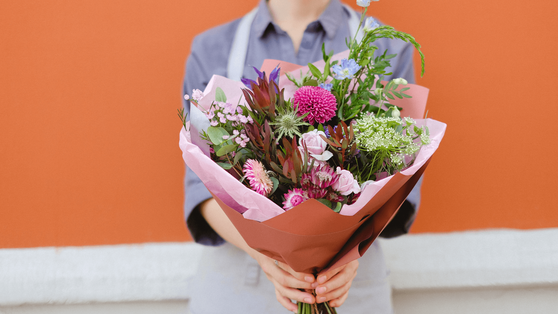A girl holding a bouquet of fresh flowers