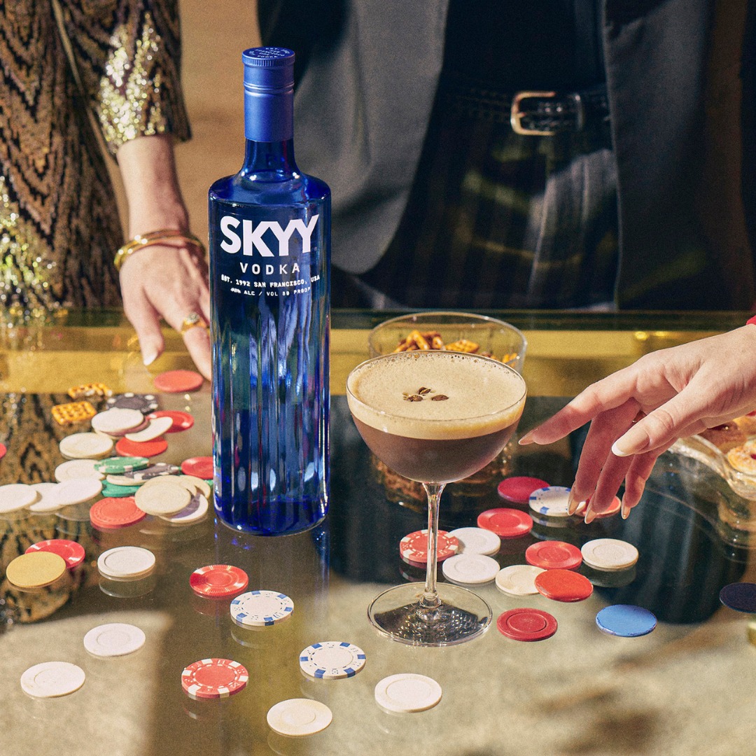 A bottle of Skyy Vodka shared by people playing poker